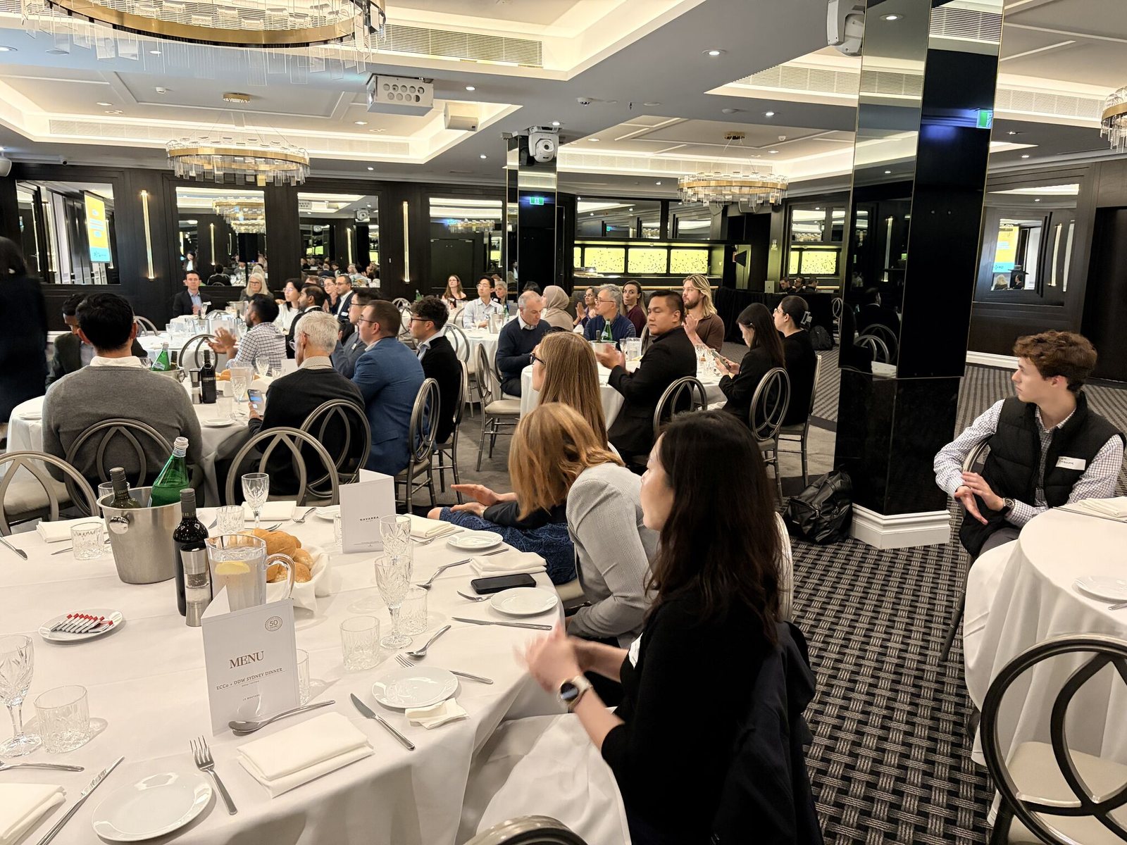Gastroenterologists, dietitians, nurses and trainees seated at tables during the limbic LIVE inflammatory bowel disease meeting in Sydney